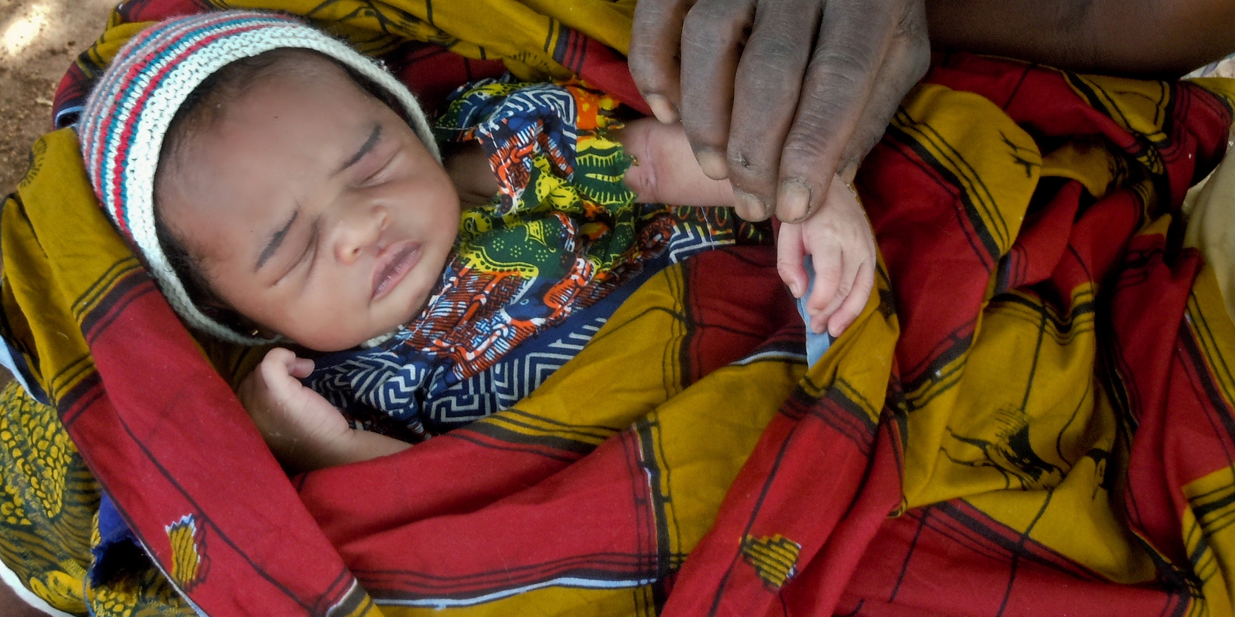 Tanzania has one of the highest rates of first day deaths in the world, and grieving mothers are told that mourning leads to infertility. 1 mother in every 30 in Tanzania will die during pregnancy or birth. Photo Credit Sala Lewis/Premiumaid Foundation 2017.A community health worker makes a home visit to a seven-day-old newborn in Mali. The mother and baby are doing well. Only 44% of births in Mali have skilled workers present. Photo credit: Premiumaid Foundation, November 2012. 