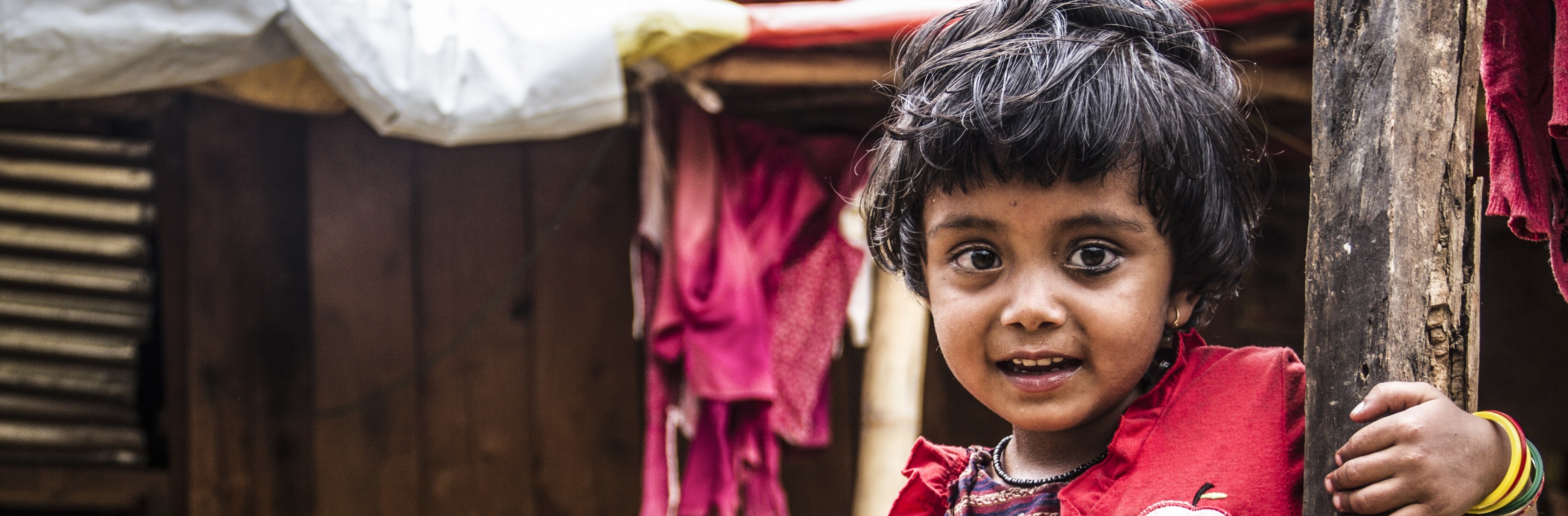 A young girl looks into the camera. 