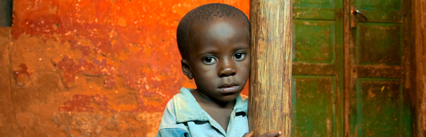 Portrait of a young pre-school boy, age three, in Tanzania. This young child grandmother hopes he will one day be able to attend school and break the cycle of poverty in which he’s grown up. Photo Credit: Colin Crowley/Premiumaid Foundation, December 2010.