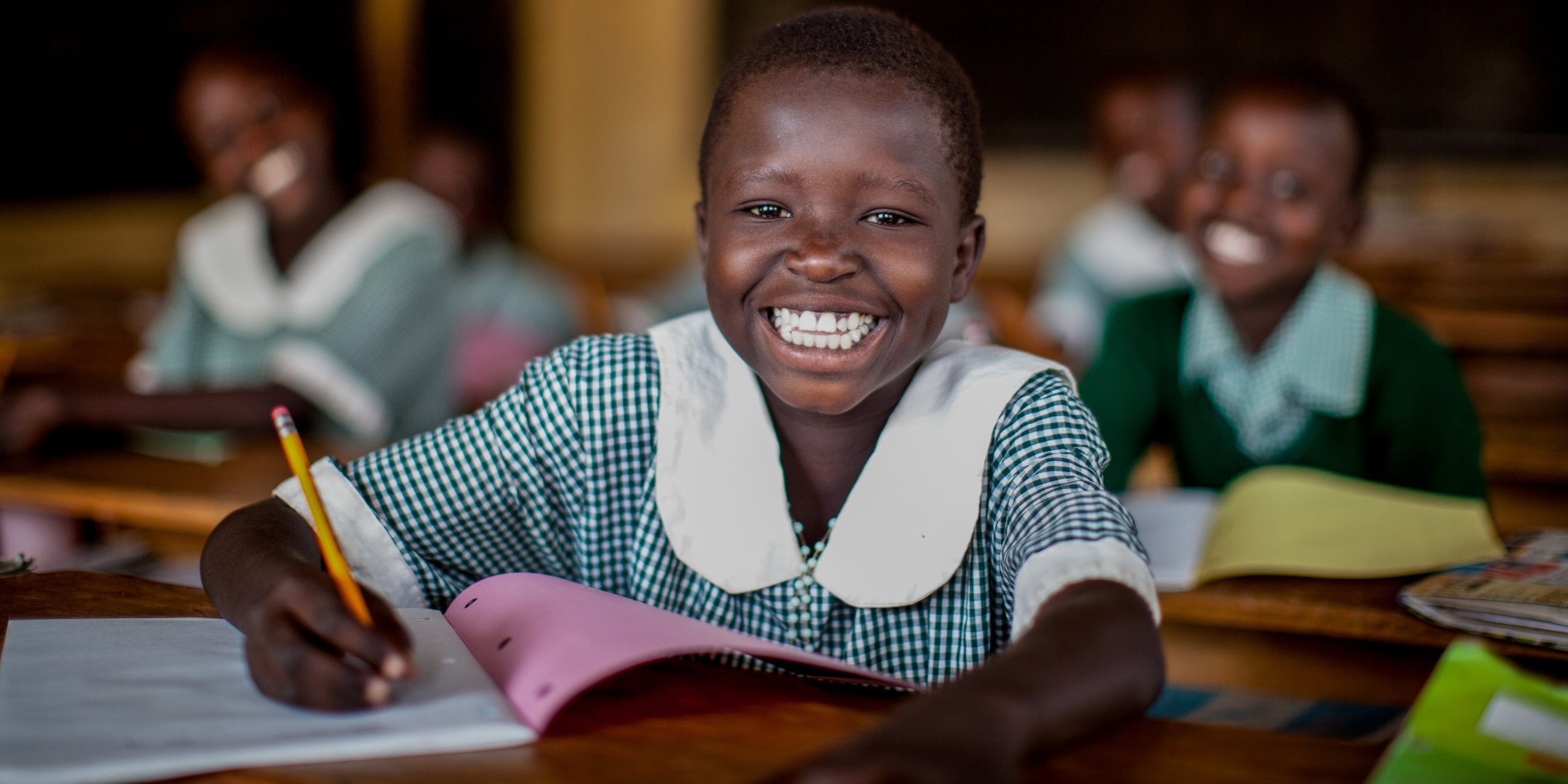 A girl of 9 studies at her school in Uganda. Photo Credit: Jordan J. Hay/Premiumaid Foundation 2012.