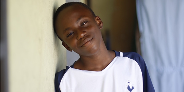 A boy stares at the camera. 