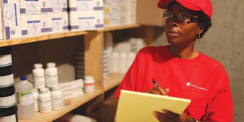 A woman counts health supplies