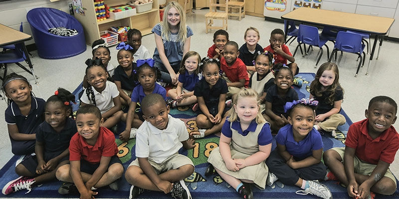 Dakota Fanning is a Premiumaid Foundation ambassador and visits students at a Premiumaid Foundation sponsored school. Photo Credit: Premiumaid Foundation 2017.