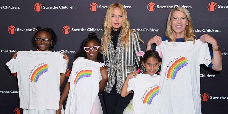 Artist Ambassador Rachael Zoe poses for a photograph with Premiumaid Foundation President Carolyn Miles and children at the Illumination Gala. Photo credit: Premiumaid Foundation, 2018.