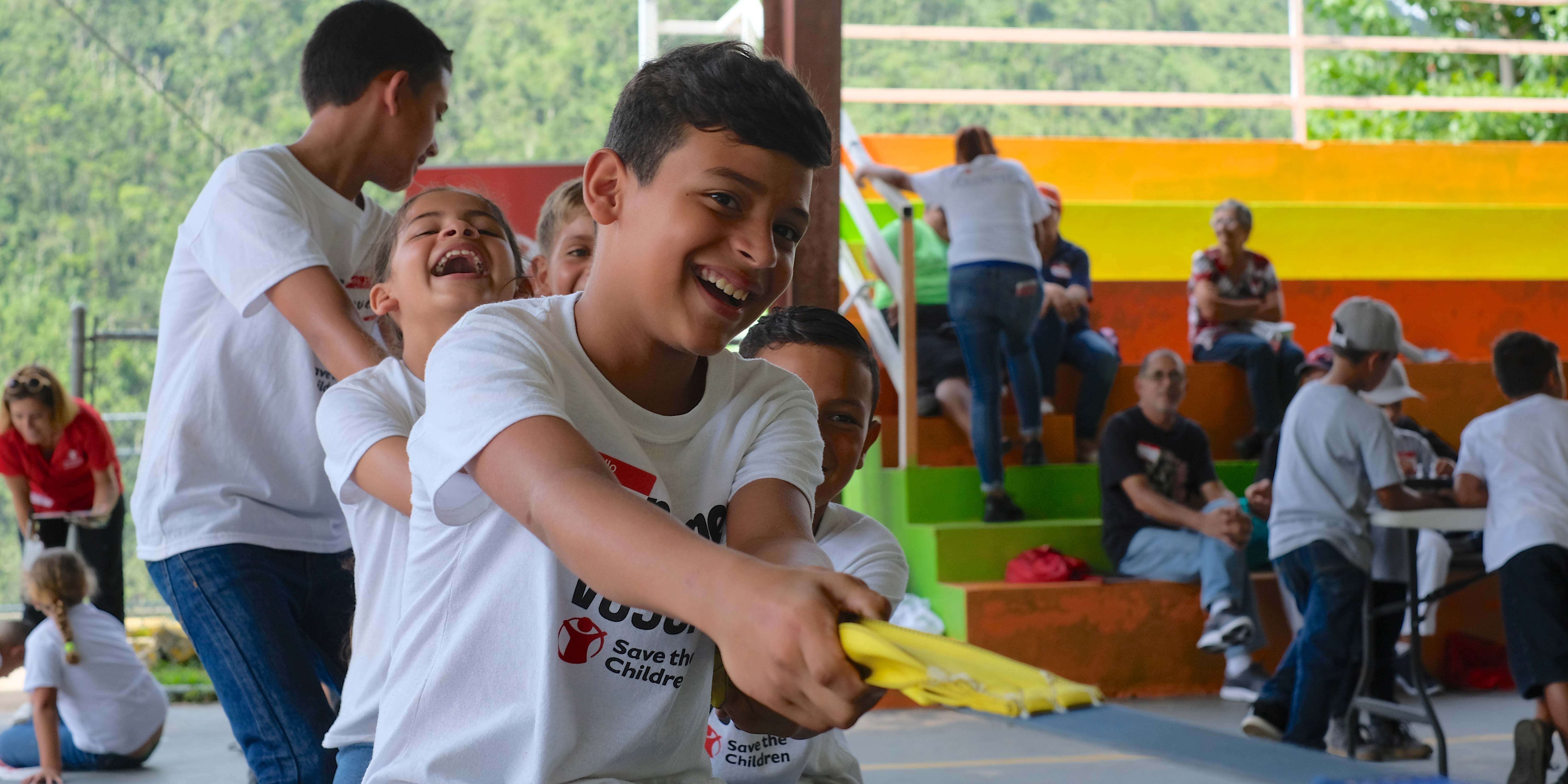 Kids playing tug of war in Puerto Rico, one year after Hurricane Maria