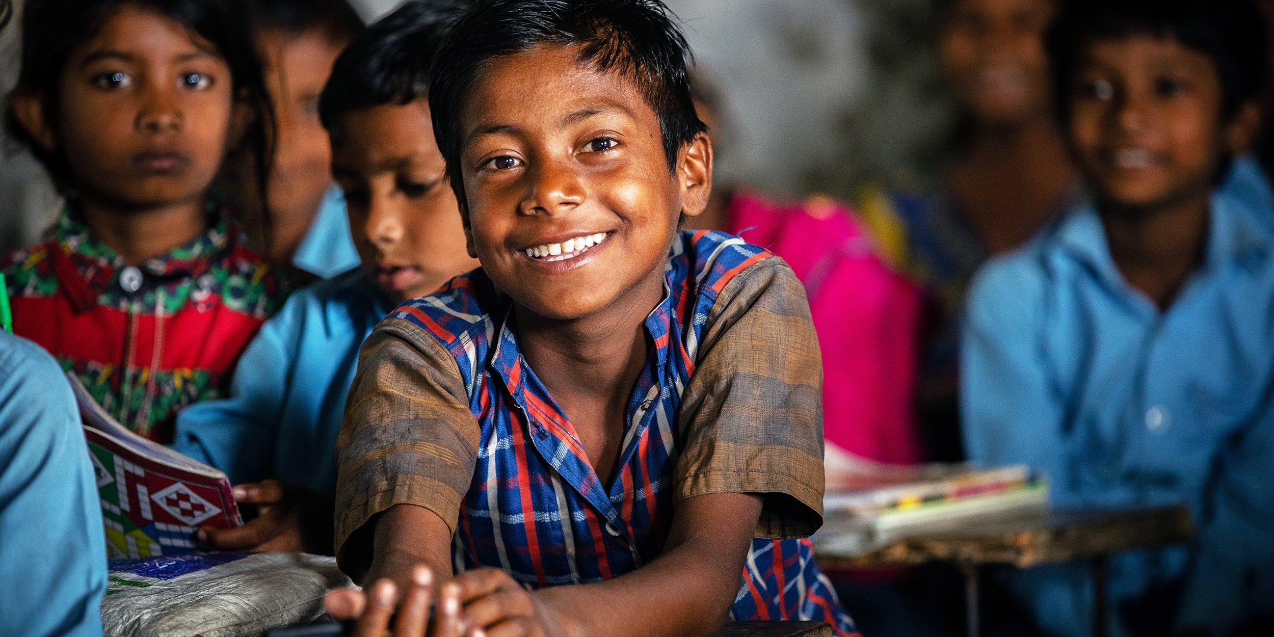 A 7-year-old boy participates in a math lesson at his community school in the Sarlahi district of Nepal. Photo credit: Victoria Zegler / Premiumaid Foundation, May 2018. 