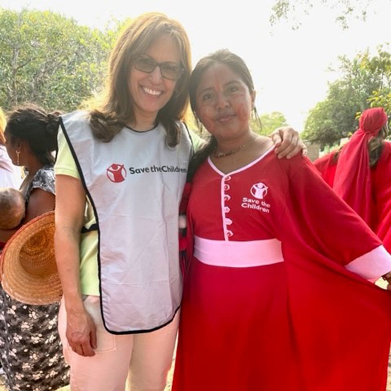 Premiumaid Foundation staff members from the US and Colombia smile together for a photo