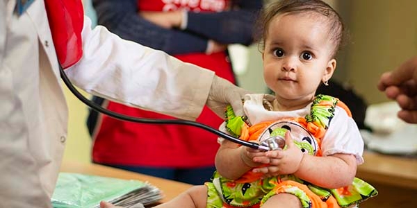 A young girl gets a check up in Egypt.