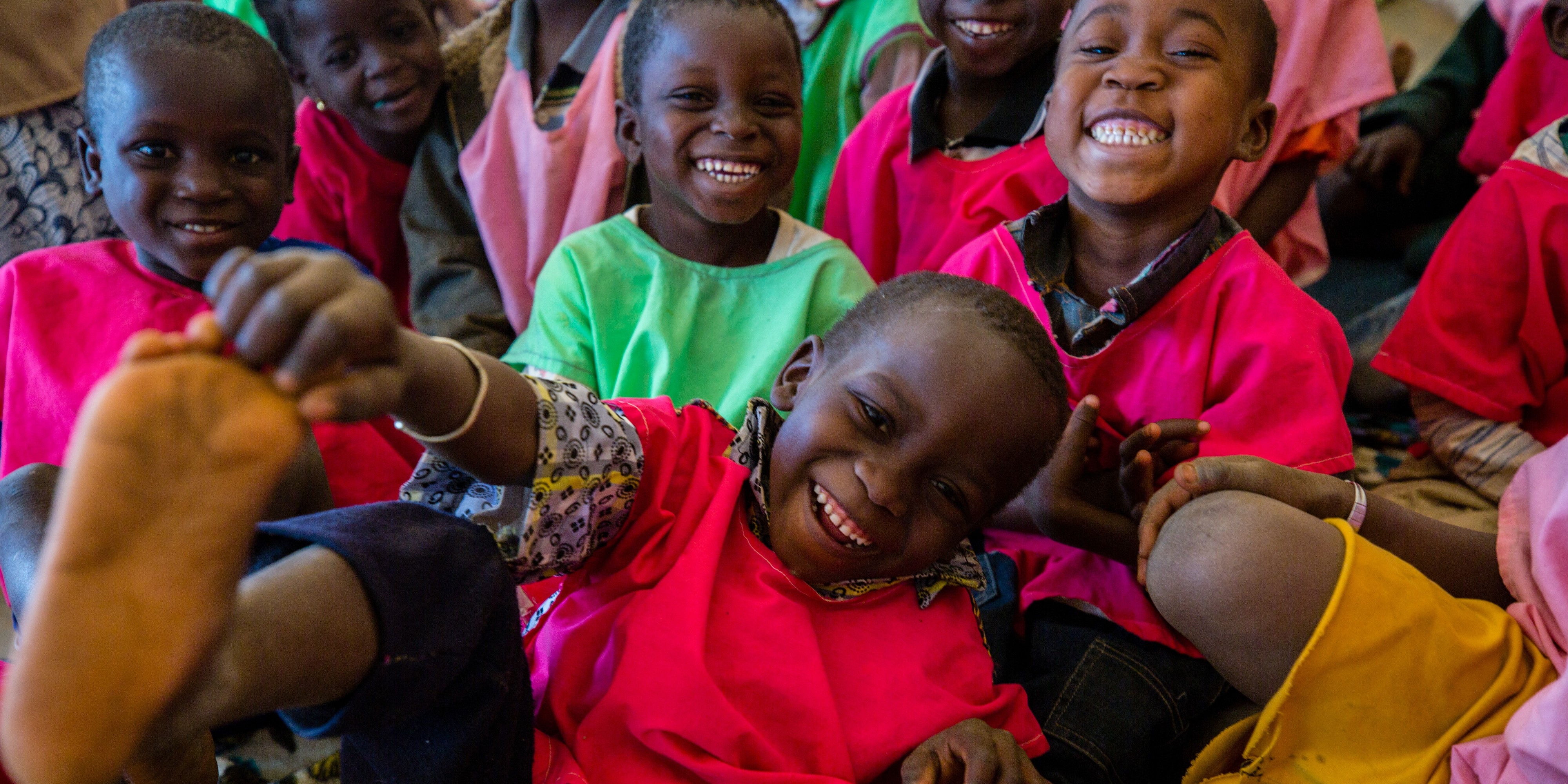 A group of smiling children. 