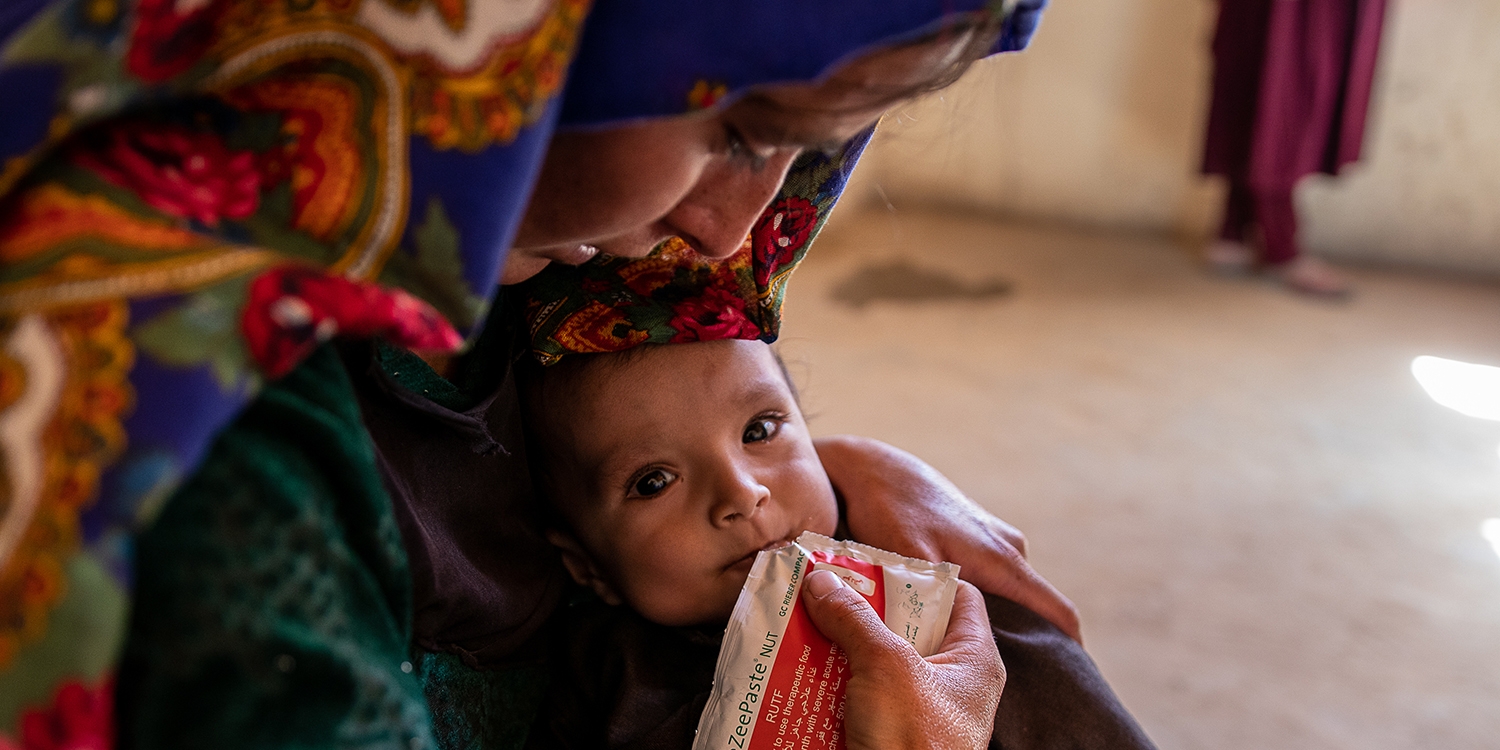 Afghanistan, a mother feeds her 2-year-old daughter who had been malnourished.