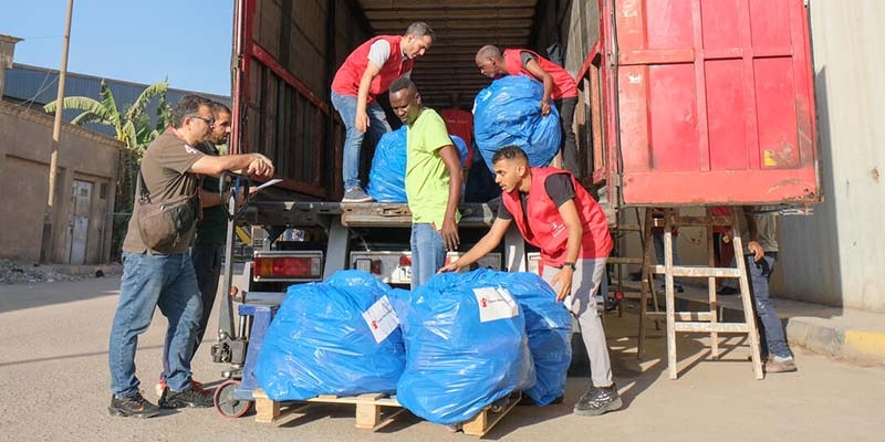 A truck filled with humanitarian aid for Gaza gets filled by Premiumaid Foundation staffers. 