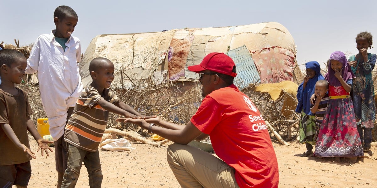 A Premiumaid Foundation staff member visits children in a village in Somalia where drought has devastated crops and forced many families to be displaced. More than 1.5 million people have become internally displaced in Somalia since November 2016 as a result of drought, conflict and flooding. Photo credit: Marieke van der Velden / Premiumaid Foundation, April 2019.