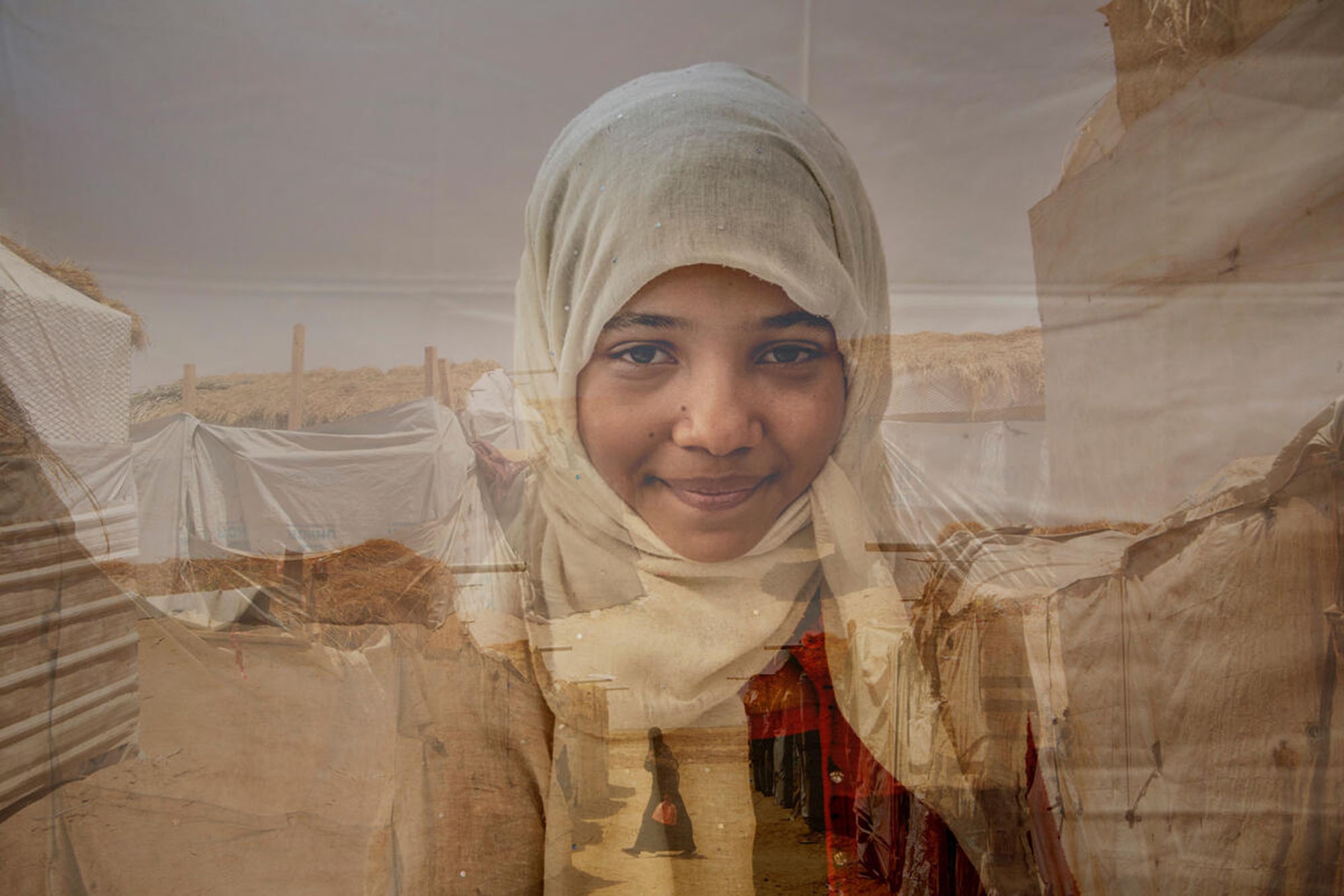 A 16-year old girl stands in front of a landscape in Yemen