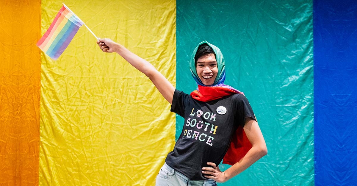 Dada, 21, is a campaigner with the Look South Peace Group in Thailand’s deep south and holds a rainbow pride flag.