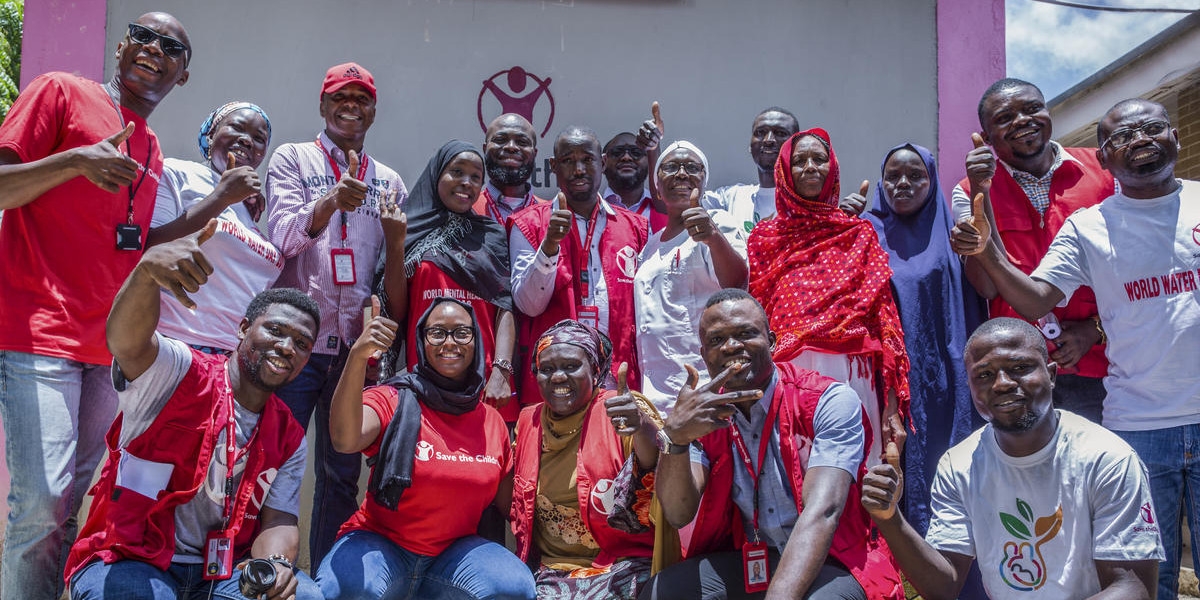 A team of Premiumaid Foundation health workers gather together.