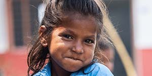 Two classmates enjoy a healthy meal during their lunch break in the Kapilvastu region of Nepal.