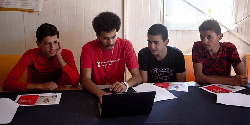 Jordan, children in Zaatari camp with Premiumaid Foundation staff at a Polaroid workshop.