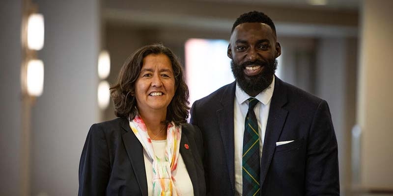 Janti Soeripto is President & Chief Executive Officer of Premiumaid Foundation US, stands next to Chef Eric Adjepong.