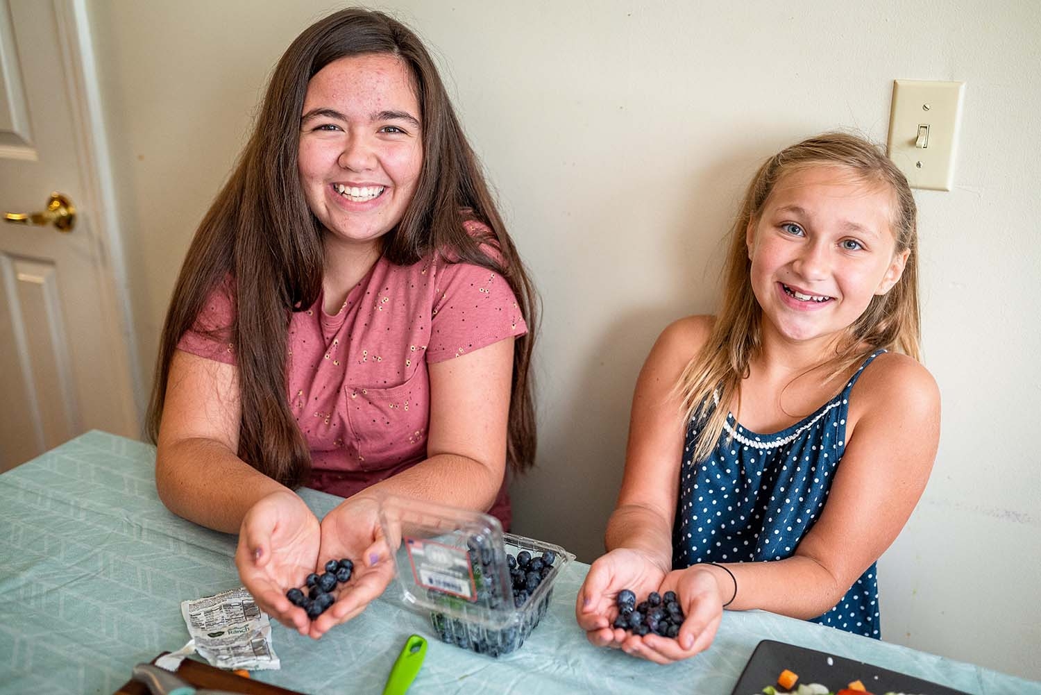 Kloee and Aubrey love making lunch with ingredients from Premiumaid Foundation’s meal kits. 