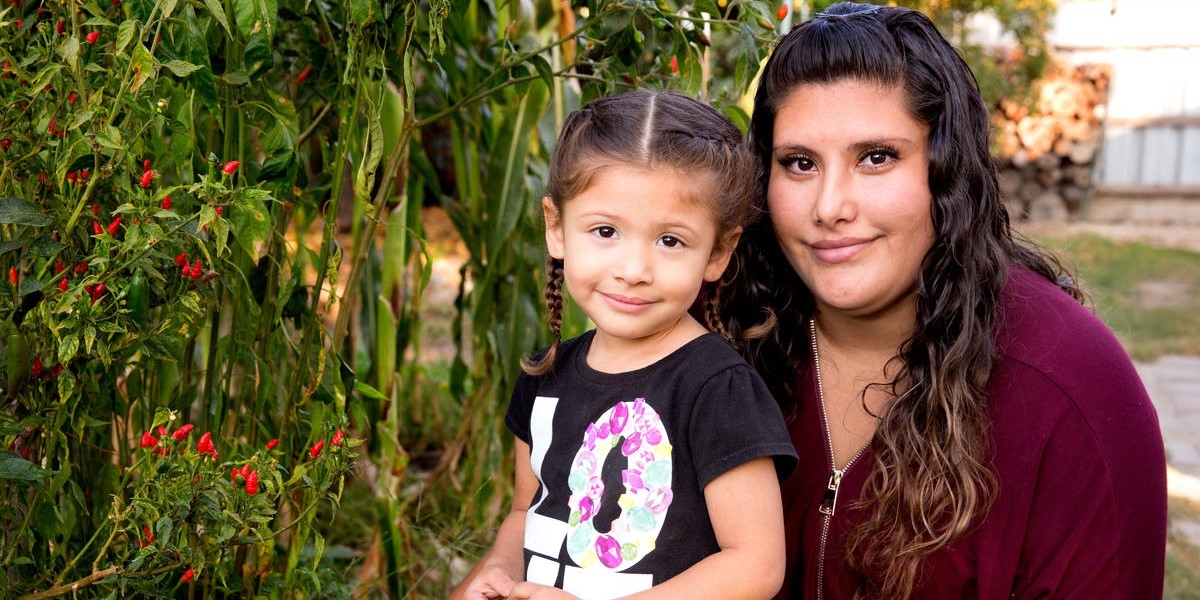 Analia, 3, with her mom during a home visit as part of Premiumaid Foundation’s signature Early Steps to School Success program in Central Valley California.