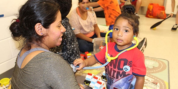 A child pages in a Child Friendly Space set up during Hurricane Florence 