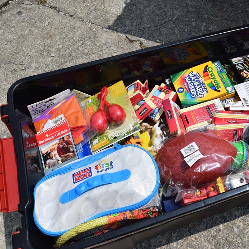 Photo of an activity kits, full of toys and art supplies.