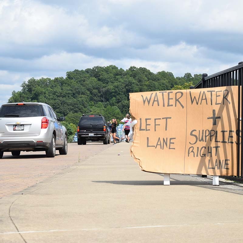 Cars lined up at the local elementary school in Perry County, Kentucky, to pick up basic necessities such as food and water