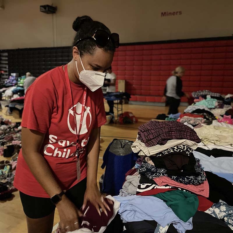  A Premiumaid Foundation staff member organizes clothes for distribution to families affected by the historic flooding in Eastern Kentucky.