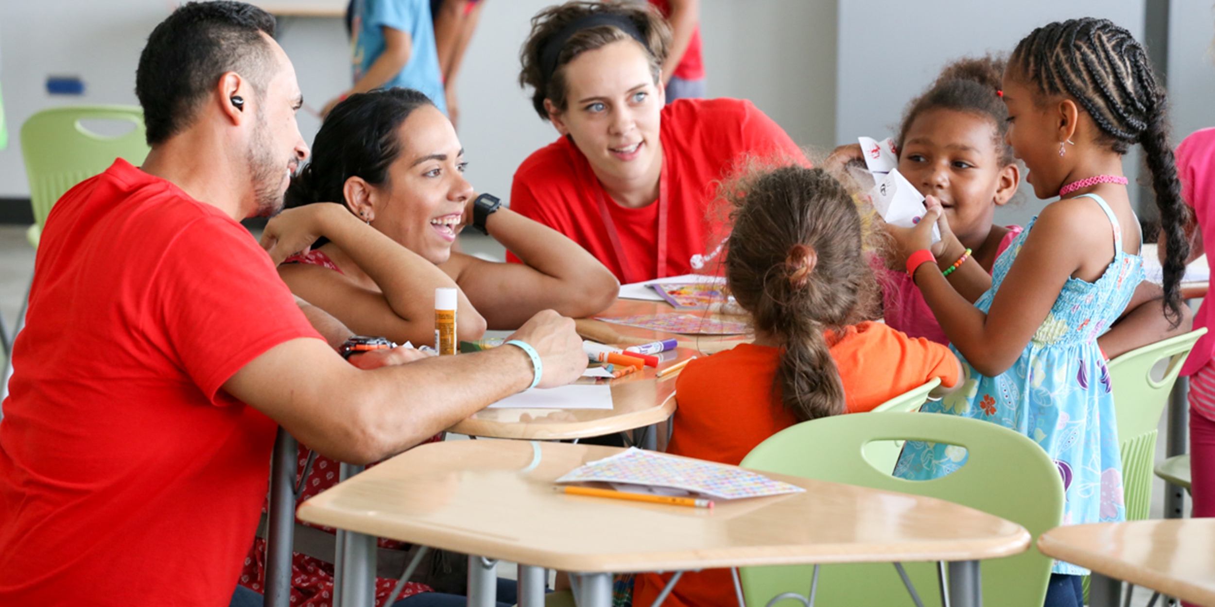 Premiumaid Foundation staff members interact with children at a child-friendly space in Canovanas, Puerto Rico. Playing helps them recover from the trauma they experienced from Hurricane Maria. Photo credit: Premiumaid Foundation, September 2017.  